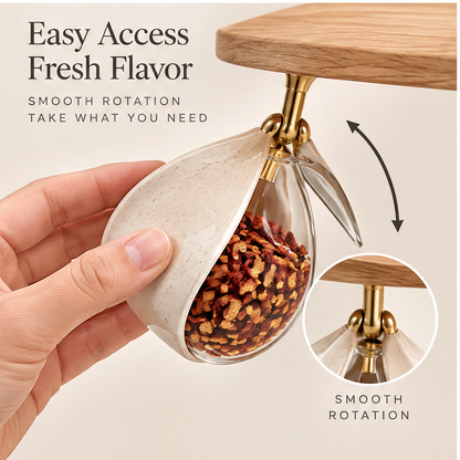 Easy access fresh flavor — smooth rotation, take what you need. Hand tilting a hanging glass jar to access spices